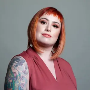 Lifestyle & Special Event Makeup by Waring Makeup - Ottawa Lifestyle Makeup Artist Woman with red hair, bold makeup, and a tattoo sleeve, styled by Waring Makeup, Ottawa Lifestyle and Special Event Makeup Artist.