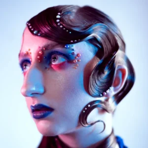 Avant-garde blue editorial makeup with gems and sculpted hair, styled by Waring Makeup, Ottawa Editorial Makeup Artist.