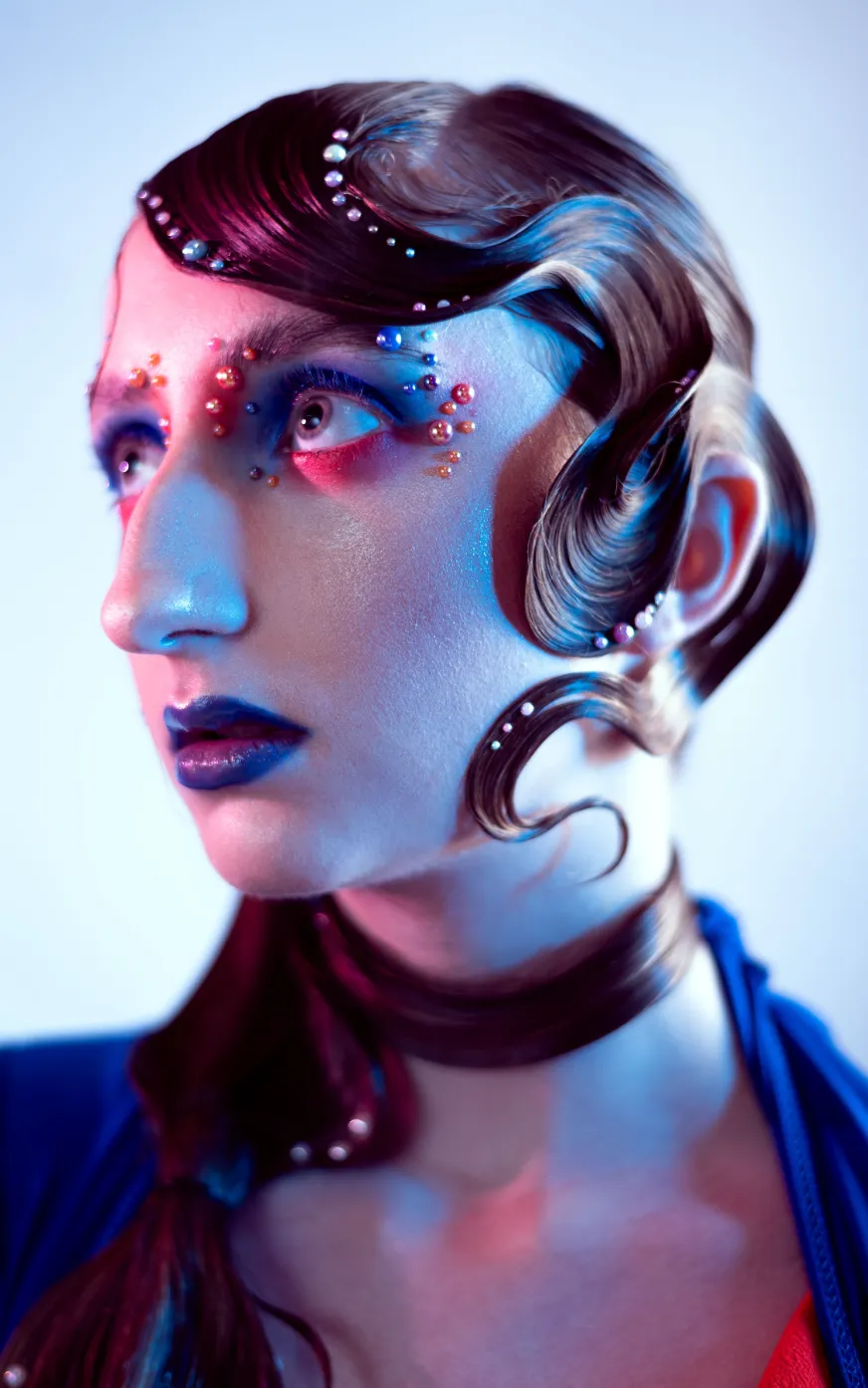 Avant-Garde Editorial Makeup by Waring Makeup - Ottawa High-Fashion Makeup Artist Avant-garde editorial makeup with sculpted hair, bold blue tones, and pearl embellishments, styled by Waring Makeup, Ottawa Editorial Makeup Artist.