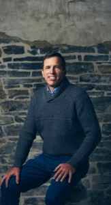 Man in business casual attire with polished corporate makeup, styled by Waring Makeup, Ottawa Corporate Makeup Artist.