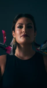 Bold and confident woman in a black dress with glam corporate event makeup, styled by Waring Makeup, Ottawa Business Makeup Services.