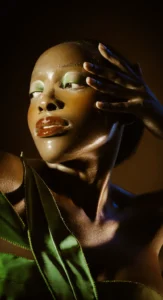 Editorial beauty makeup with metallic green eyeshadow and dewy skin, styled by Waring Makeup, Ottawa Editorial Makeup Artist.