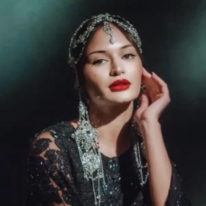 High-fashion editorial makeup with jeweled details and bold red lips, styled by Waring Makeup, Ottawa Fashion Shoot Makeup.