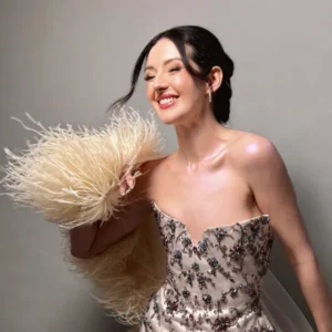 Prom glam makeup with a feathered dress and glowing skin, styled by Waring Makeup, Ottawa Prom Makeup Artist.
