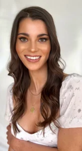 Smiling woman with wavy hair and soft glam makeup, styled by Waring Makeup, Ottawa Special Event Makeup Artist.